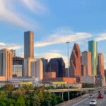 Aerial view of Downtown Houston, Texas behind a major freeway